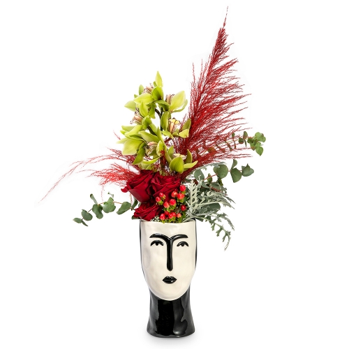 Cymbidium and red roses on a Frida Kahlo vase